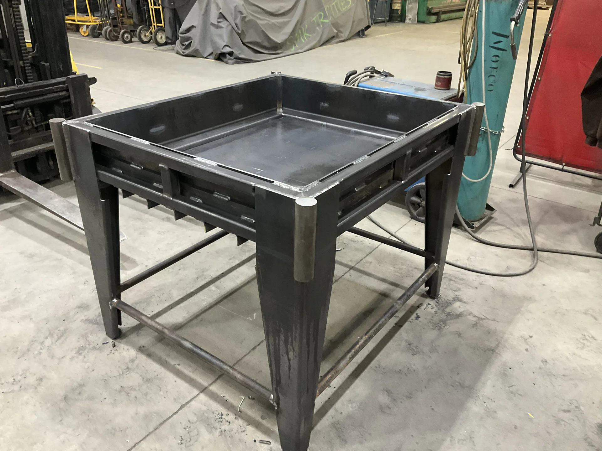 Custom welded steel table fabricated in the Barnes shop