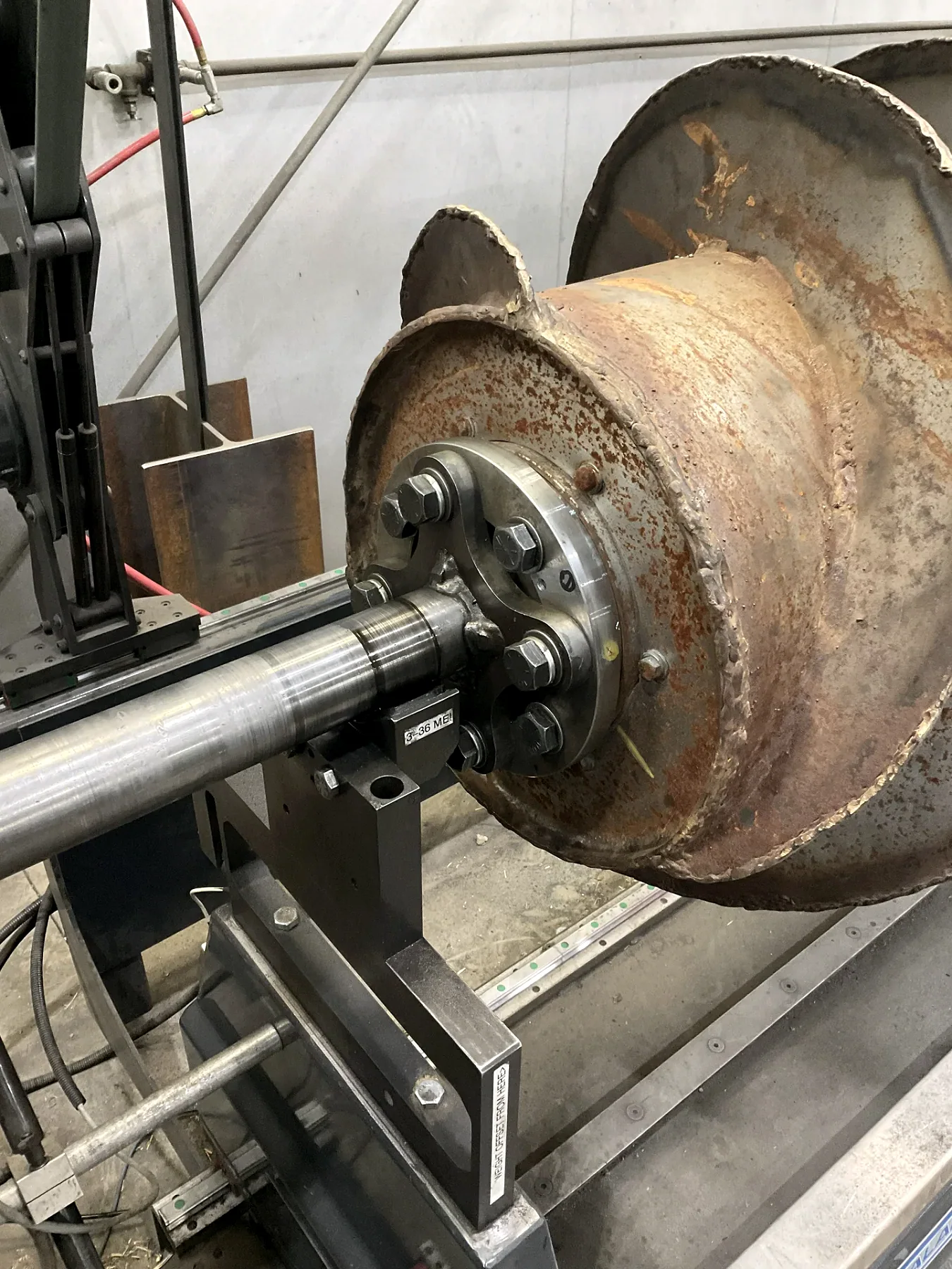 Large rotating agricultural component mounted on Barnes dynamic-balancing equipment