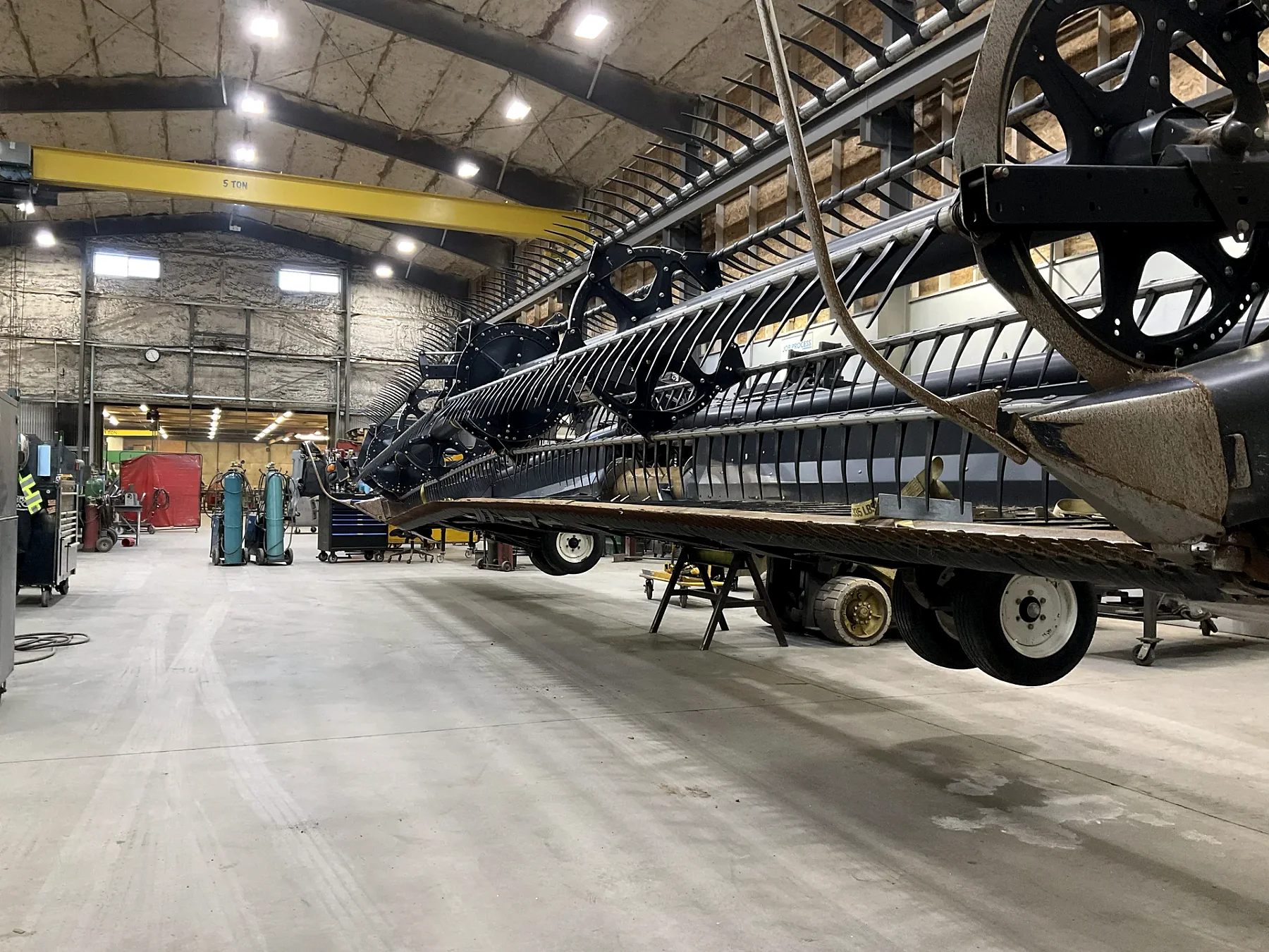 Large combine header inside the Barnes shop