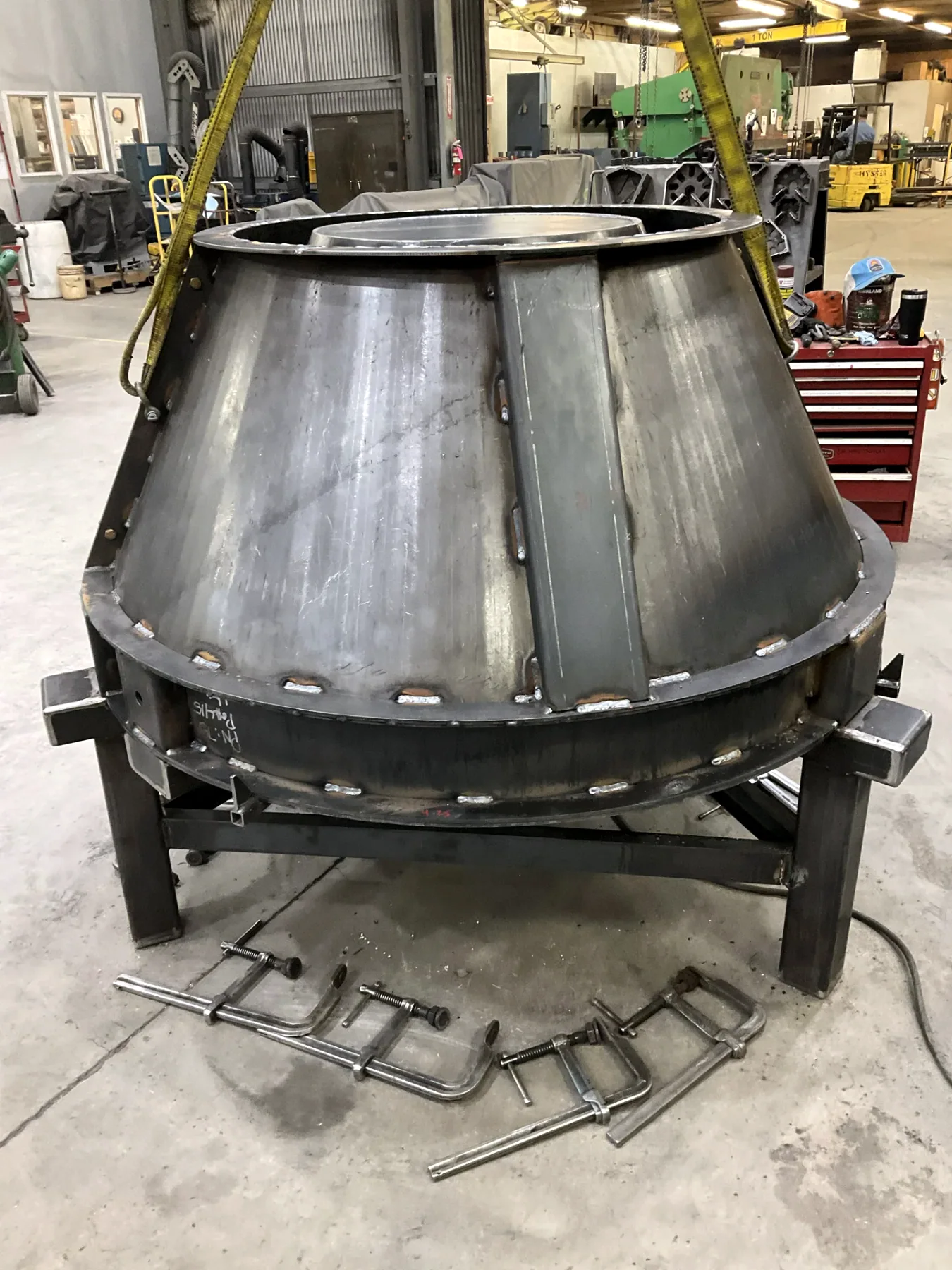 Large rolled conical steel form during fabrication in the Barnes shop