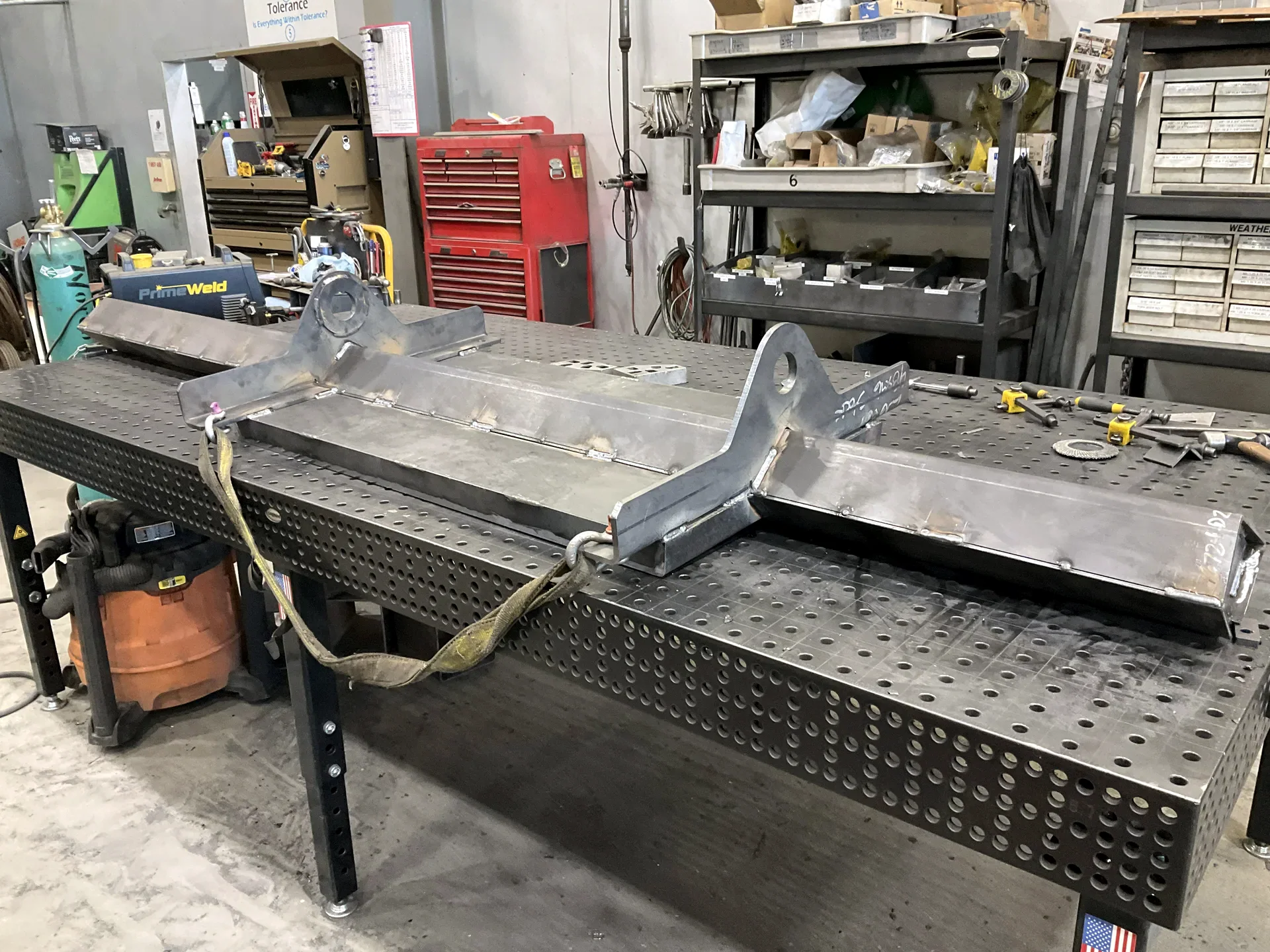 Welded steel mold component on a Barnes fabrication table