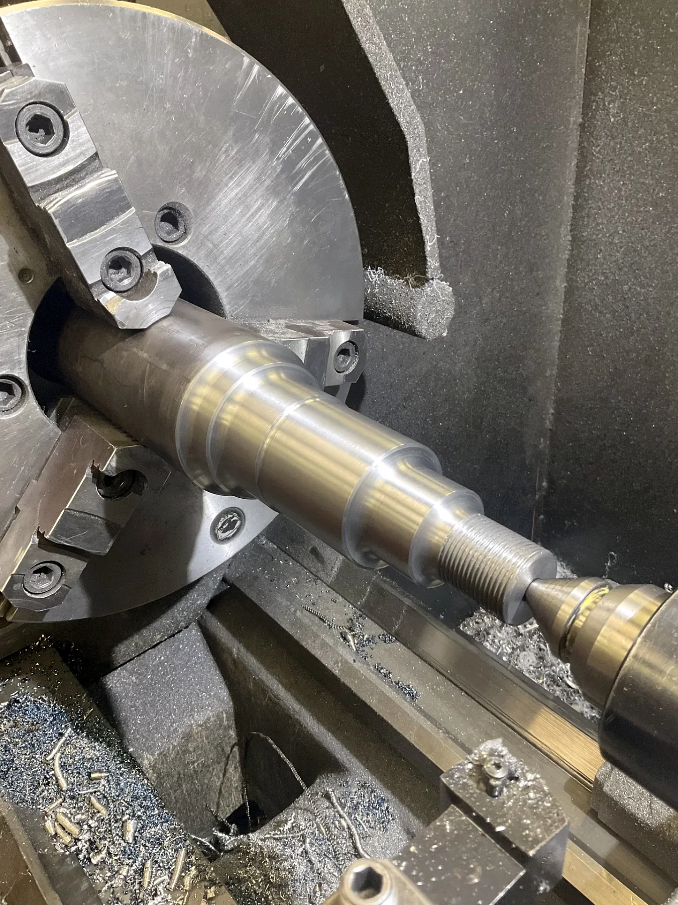 Large shaft component set up for lathe machining at Barnes Welding