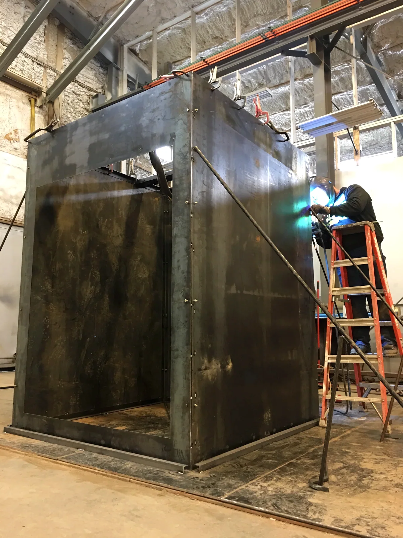 Large steel enclosure body during fabrication